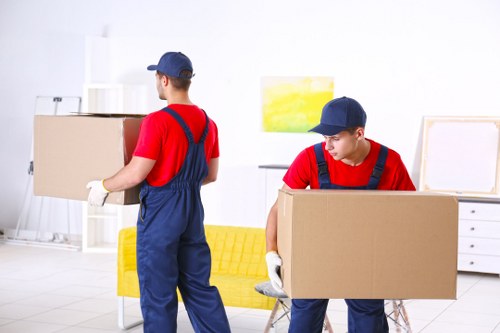 Removal van and moving team outside a Bromley residential street