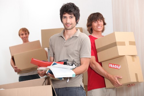 Professional movers loading a van for a local relocation