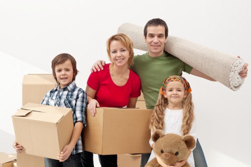 Local moving team loading furniture into a van in Bromley